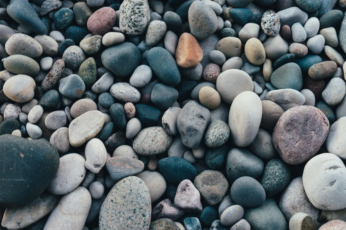 Smooth stones at the edge of a river