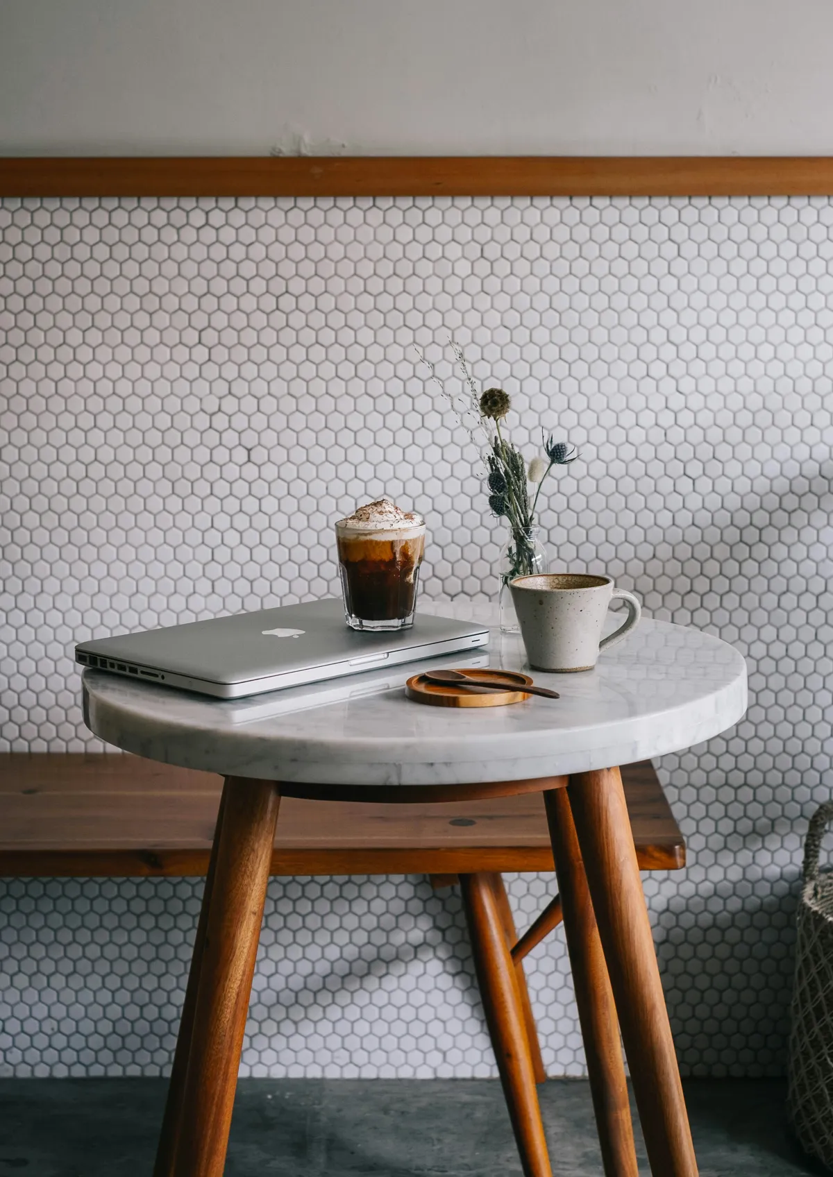 A laptop and cup of coffee on a desk